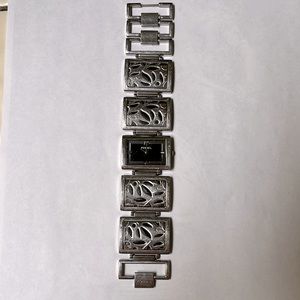 Fossil watch bracelet cuff style. Vine carving design very classy.